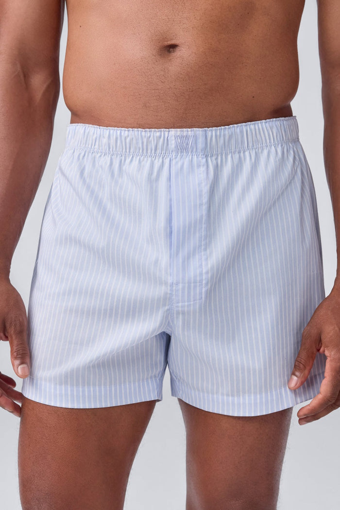 MACK WELDON 24/7 Woven Boxer in True Navy Dobby Dot features a subtle textured pattern, elastic waistband, and no visible branding, shown against a black background.