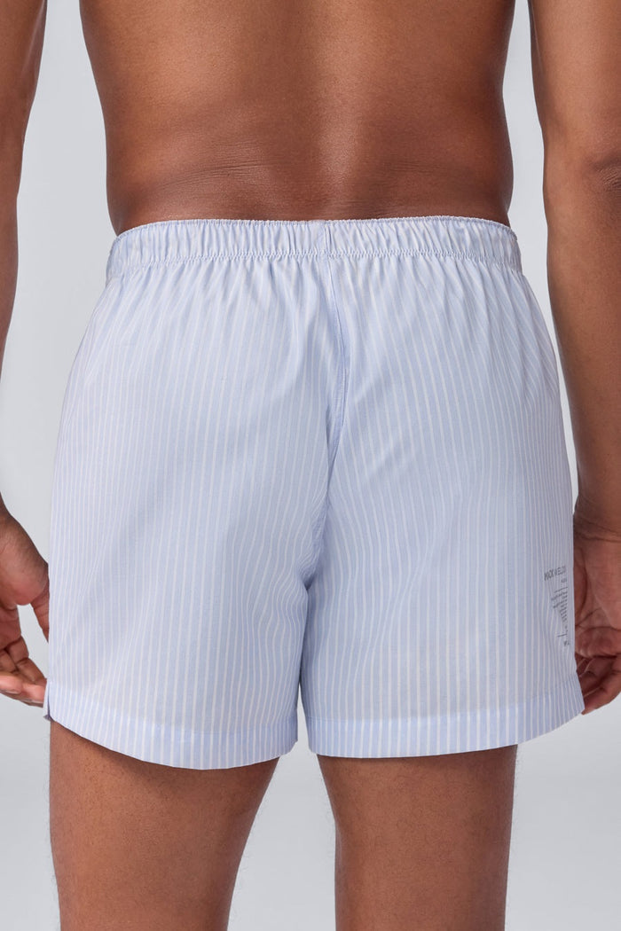 MACK WELDON 24/7 Woven Boxer in True Navy Dobby Dot features a subtle textured pattern, elastic waistband, and no visible branding, shown against a black background.