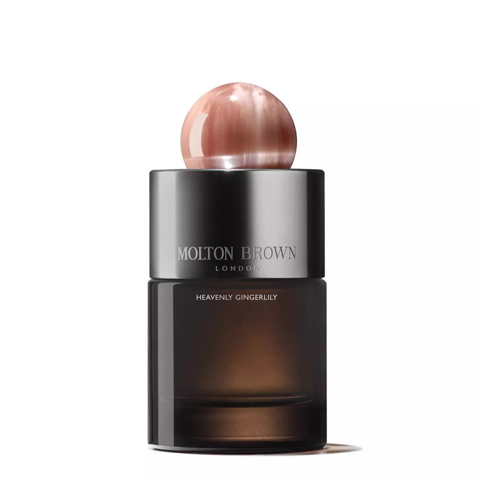 A MOLTON BROWN - HEAVENLY GINGERLILY EAU DE PARFUM bottle featuring a dark gradient refillable glass flacon, metallic label, and round pink marble-like cap is shown against a white background.