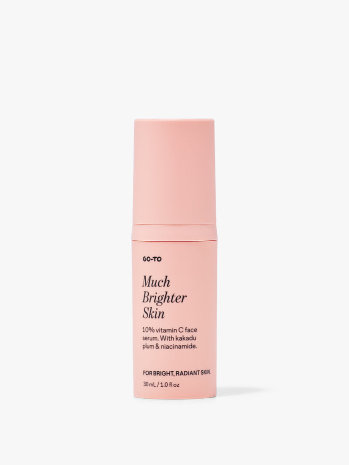 Pink bottle of Go-To's Much Brighter Skin serum with vitamin C, kakadu plum, and niacinamide for radiant skin.