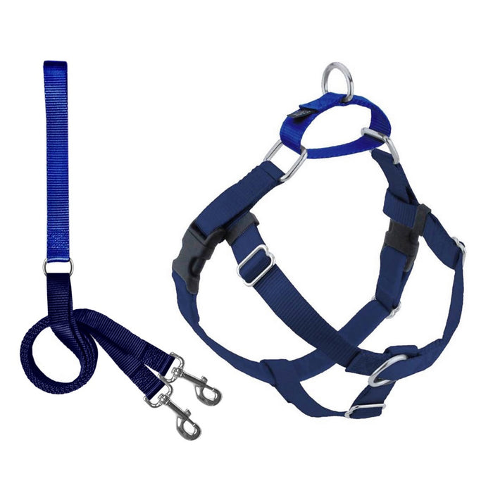 The 2 HOUNDS DESIGN NO PULL HARNESS LEASH (XS, NAVY) features adjustable straps, metal rings, and a velvet-lined chest strap for comfort, shown with a matching navy leash with metal clips for easy attachment.