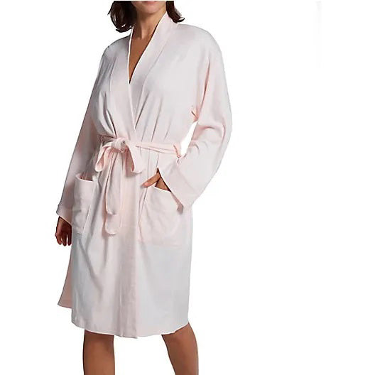 A person models the FASHIONVIEWS P. JAMAS - BUTTERKNIT SHORT ROBE, featuring long sleeves, front pockets, and a tied belt. Their head is partially out of frame against a plain background.
