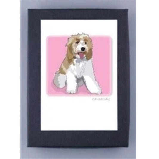 PAPER RUSSELLS - CAVADODDLE NOTE CARDS feature a fluffy, light brown and white dog with an open mouth and visible tongue, sitting on a pink background. Made in the USA on FSC certified recycled paper; cards come in a white mat with dark frame.