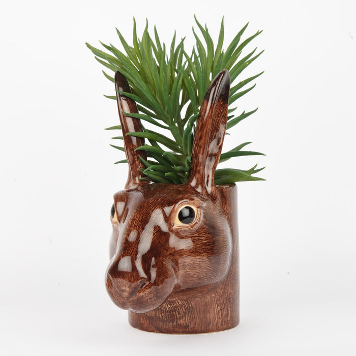 The QUAIL DESIGNS QUAIL CERAMICS - HARE PENCIL POT is a 15 cm hand-painted stoneware pencil holder shaped like a brown hare's head with textured fur, upright ears, and glossy finish. Dishwasher safe and shown on a plain white background.