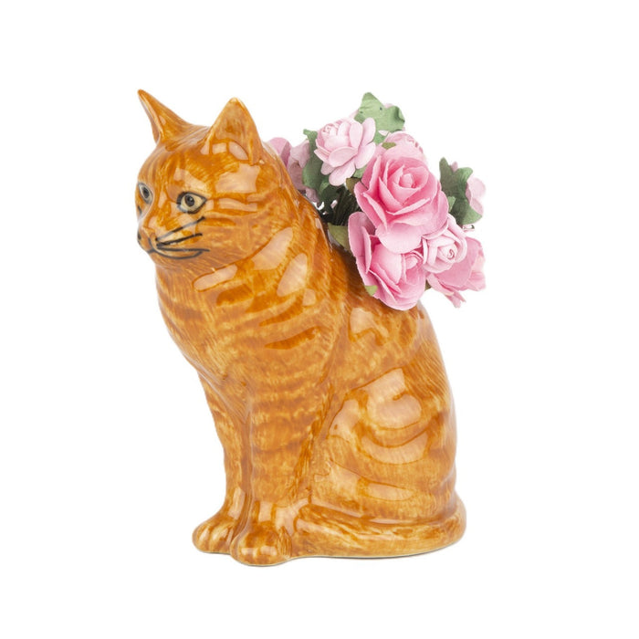 The QUAIL CERAMICS - VINCENT CAT BUD VASE by QUAIL DESIGNS is a hand-painted ceramic vase shaped like an orange tabby cat, featuring pink artificial roses arranged on its back.