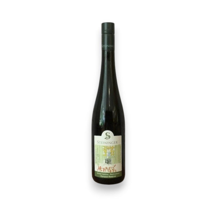 A dark green STEININGER LOISIUM GRUNER VELTLINER 2022 wine bottle from WINE: A-VIN-GARDE/BORDEAUX FINE & RARE has a long neck, black cap, white label, and red-green graphics. Citrus and stone fruit notes; shown on a plain white background.